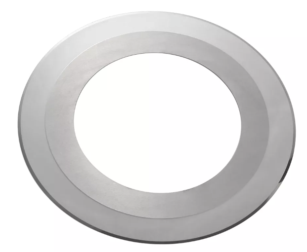 A close-up of a circular saw blade, showing sharp teeth designed for cutting through wood and other materials.